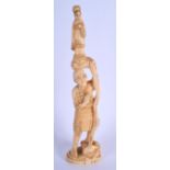 A LATE 19TH CENTURY JAPANESE MEIJI PERIOD CARVED BONE OKIMONO modelled holding aloft a Buddhistic d