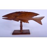 A VINTAGE PITCAIRN ISLANDS FIGURE OF A FLYING FISH upon a rectangular plinth. 20 cm x 27 cm.
