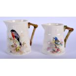 Royal Worcester large barrel shape moulded jug painted with a bullfinch and a slightly small one pai