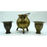A small Middle Eastern brass censer together with two embossed vases 14 x11cm (3).