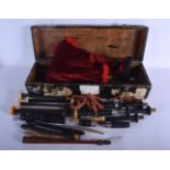 A CASED SET OF VINTAGE SCOTTISH BAGPIPES within fitted box. 46 cm long.