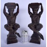 A PAIR OF 19TH CENTURY NORTHERN EUROPEAN CARVED WOOD FIGURAL SUPPORTS modelled as figures with legs