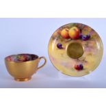 Royal Worcester cup and saucer painted on the inside with fruit by H. Price, signed, date mark 1921.