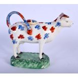 A RARE EARLY 19TH CENTURY WELSH SWANSEA POTTERY COW CREAMER AND COVER C1810 painted with blue and re