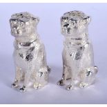 A PAIR OF SILVER PLATED DOG CONDIMENTS. 8 cm x 5 cm.