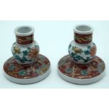 A pair of 19th Century Japanese Kutani ceramic candlestick holders 10cm (2)