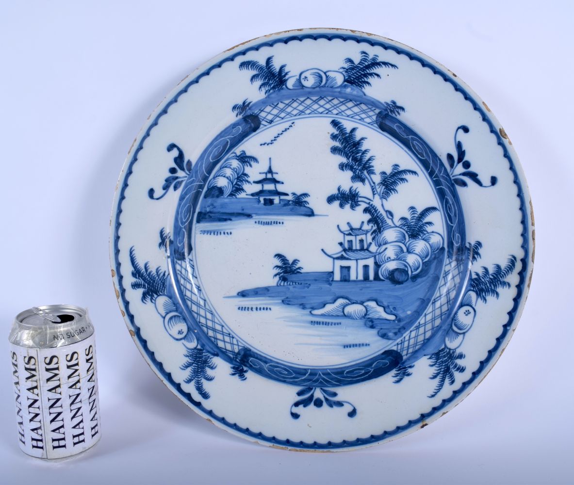 A LARGE 18TH CENTURY DUTCH DELFT BLUE AND WHITE CIRCULAR DISH painted with a hut upon an island. 32