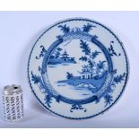 A LARGE 18TH CENTURY DUTCH DELFT BLUE AND WHITE CIRCULAR DISH painted with a hut upon an island. 32
