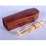 A CONTINENTAL CARVED BONE AND WOOD COFFIN. 12 cm x 4 cm.