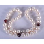 A PEARL NECKLACEWITH 18CT GOLD, DIAMOND AND ENAMEL BEADS. 40 cm long.