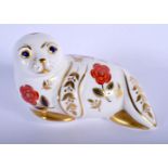 Royal Crown Derby paperweight of a seal. 13.5cm long