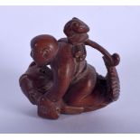 A JAPANESE BOXWOOD CARVED FISH NETSUKE. 4 cm x 3 cm.