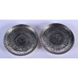 TWO CHINESE WHITE METAL COIN DISHES 20th Century. 8.5 cm diameter. (2)