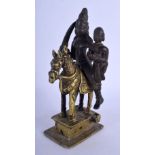 AN 18TH/19TH CENTURY INDIAN BRONZE BUDDHISTIC FIGURE OF A DEITY modelled upon a horse. 17 cm high.