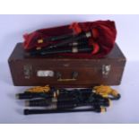 A CASED SET OF VINTAGE SCOTTISH BAGPIPES within fitted box. 46 cm long.