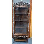 A 19TH CENTURY CHINESE CARVED HARDWOOD HONGMU DISPLAY CABINET of bamboo type form. 186 cm x 64 cm.