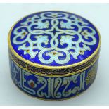 A small enamelled Islamic lidded box 8 x 4cm