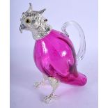 A SILVER PLATED CRANBERRY GLASS PARROT JUG. 16 cm x 13 cm.