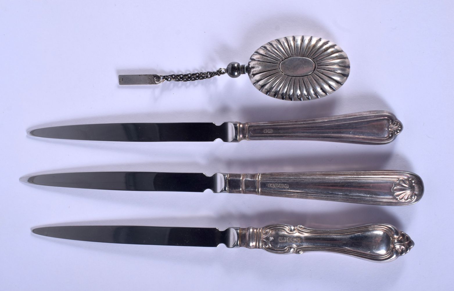 THREE SILVER HANDLED PAPER KNIVES and a white metal perfume flask. Largest 18 cm long. (4) - Image 2 of 7