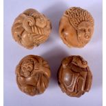 FOUR CHINESE CARVED TAG NUT CARVINGS. 3 cm wide. (4)