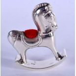 A SILVER ROCKING HORSE PIN CUSHION. 24 grams. 6.5 cm x 5 cm.