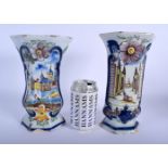 A PAIR OF 19TH CENTURY DUTCH DELFT FAIENCE TIN GLAZED VASES painted with landscapes. 22 cm x 12 cm.