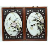 A pair of Chinese framed porcelain panels decorated with birds, flowers and calligraphy 34 x 25cm (