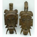 A pair of African masks 44cm . (2).