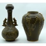 A Chinese twin handled vase decorated with foliage in relief together with another vase 31 cm (2)