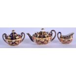 Royal Crown Derby miniature tea set: teapot and cover, sucrier and cover and milk jug pattern 2451,