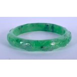A CHINESE GREEN JADE BANGLE 20th Century. 7 cm wide.