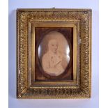 AN EARLY 19TH CENTURY ENGLISH PAINTED WATERCOLOUR PORTRAIT MINIATURE depicting a seated male. Image