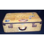 A vintage canvas covered suitcase with Bakelite handle 68 x 45 cm.