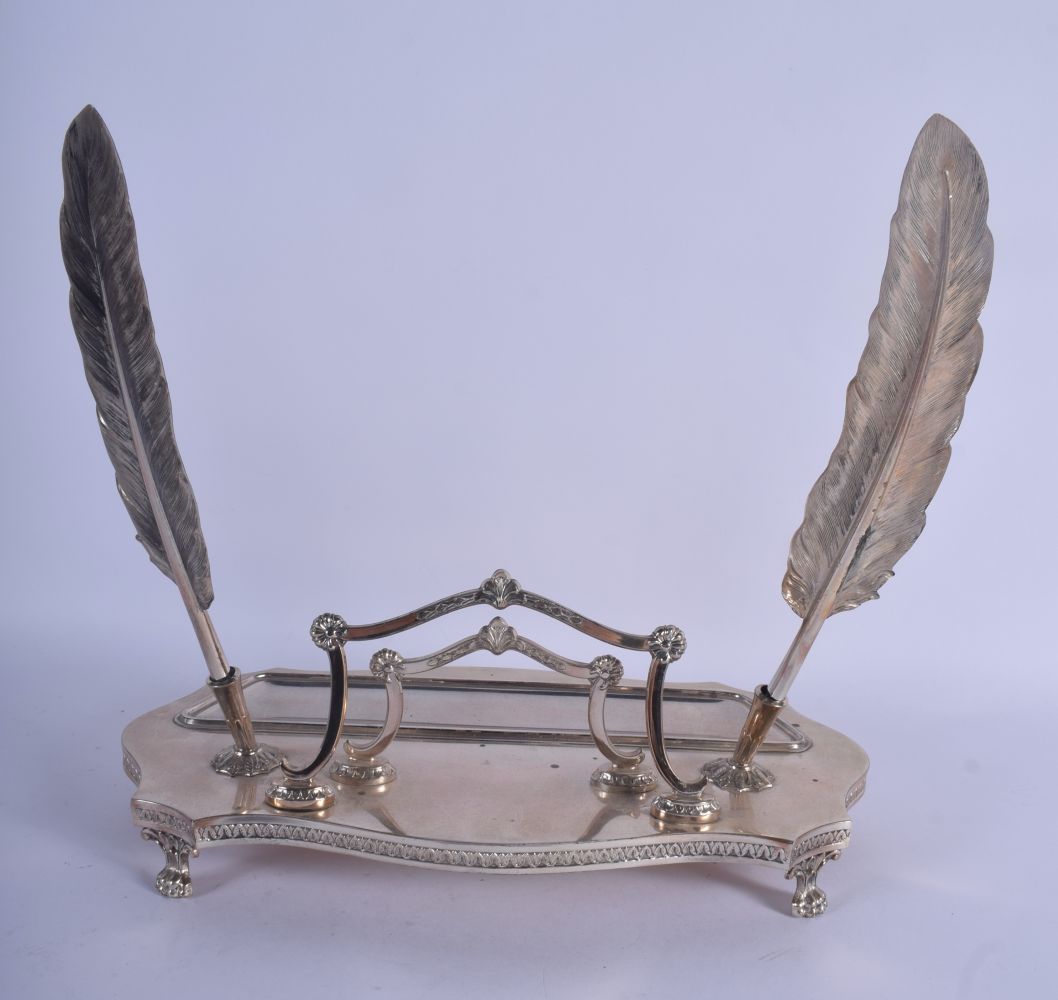 AN EARLY 20TH CENTURY CONTINENTAL WHITE METAL INKWELL of scrolling form with 2 feather quills. 26 cm - Image 2 of 4