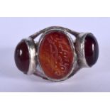 A VINTAGE MIDDLE EASTERN SILVER AND AGATE KUFIC SCRIPT RING. V/W. 21 grams.