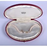 A CASED EDWARDIAN 9CT GOLD PEARL NECKLACE. 40 cm long.