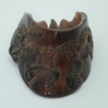 A Chinese carved hoof decorated with figures in a landscape 15cm .