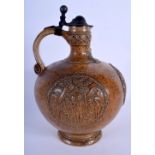 A LARGE ANTIQUE GERMAN BELLARMINE MERKELBACH GRENZHAUSEN BELLARMINE JUG with pewter mounts. 27 cm hi