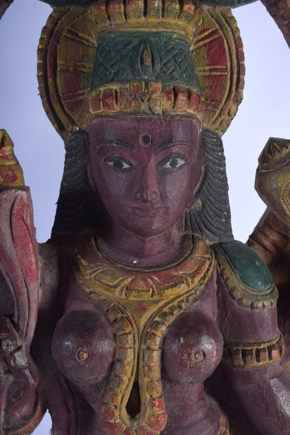 A LARGE INDIAN CARVED POLYCHROMED WOOD FIGURE OF FOUR ARMED DURGA modelled with a lion behind her. 5 - Image 2 of 5