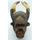 TRIBAL AFRICAN ART IGBO MGBEDIKE MASK. Nigeria. This mask type stands in certain conceptual opposi
