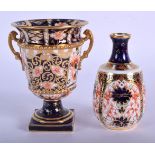 Royal Crown Derby two handled vase painted with pattern 6299, date code 1918 and a smaller vase pain