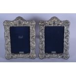 A PAIR OF 1970S ENGLISH SILVER PHOTOGRAPH FRAMES. 22 cm x 16 cm.