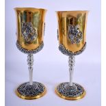 A PAIR OF RUSSIAN YELLOW AND WHITE CLASSICAL BEAKERS probably silver and silver gilt. 735 grams. 21