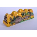 A CHINESE YELLOW GLAZED POTTERY BRUSH REST 20th Century. 11 cm x 4 cm.