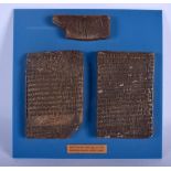 THREE CUNIFORM MUSEUM CASTS Babylonian contract. Largest 11 cm x 7 cm. (3)