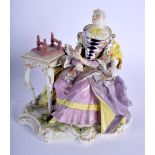 A 19TH CENTURY SITZENDORF PORCELAIN FIGURE OF A SEATED FEMALE modelled seated beside a high table. 2