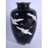 A SMALLER EARLY 20TH CENTURY JAPANESE MEIJI PERIOD ENAMEL VASE decorated with birds in flight. 12.5