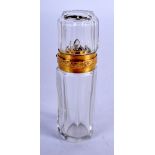 AN ANTIQUE 18CT GOLD AND CRYSTAL GLASS SCENT BOTTLE. 10 cm high.