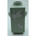 A Chinese Celadon Kong vase decorated in relief with cranes. 26cm .