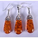TWO SILVER AMBER EARRINGS and a pendant. 11.5 grams. 4.5 cm x 1.5 cm. (3)